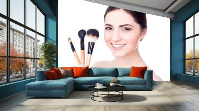 close up portrait of young beautiful woman with make up brushes Wall mural