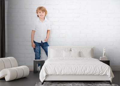 full length portrait of cute little boy posing over white Wall mural