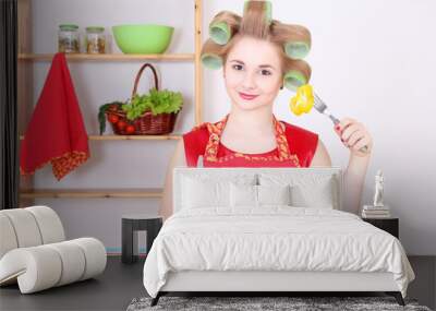 housewife eating vegetables in the kitchen Wall mural