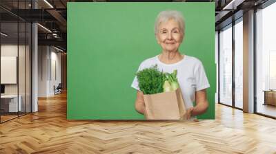 senior woman with paper bag with food Wall mural