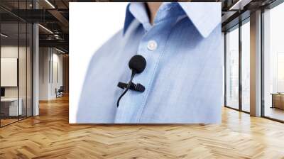 sound recording concept - close up of small lavalier clip-on microphone on male shirt Wall mural