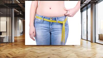 weight loss concept - close up of overweight woman's belly and m Wall mural