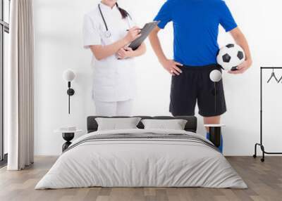 young female doctor and soccer player on white background Wall mural