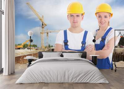 young man and woman in blue builder 's uniform Wall mural