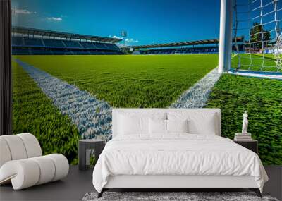 An immaculate view of a football field from the goal line, looking towards the midfield with perfect turf and line markings, large copy space in the background stands. Wall mural