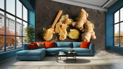 Ginger root, candied and ginger powder in wooden spoon over grey concrete background Wall mural