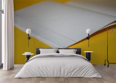 a paper new notebook on a yellow background Wall mural