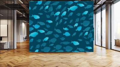 Seamless pattern with a shoal of fish on a dark blue background. Creative marine print with silhouettes of ocean fish (a floating flock of fish) . Underwater marine world backdrop. Vector illustration Wall mural