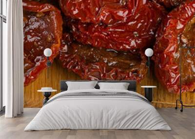 sun dried tomatoes with olive oil on wooden surface Wall mural