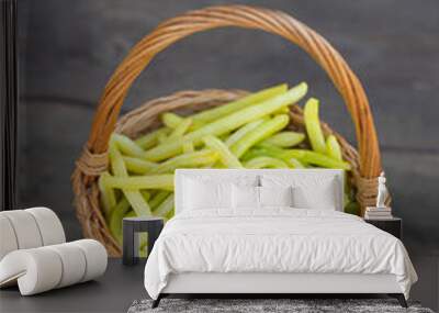 yellow string beans in a wooden basket Wall mural