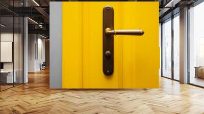 Close-up shot of yellow color door with vintage door knob. Wall mural