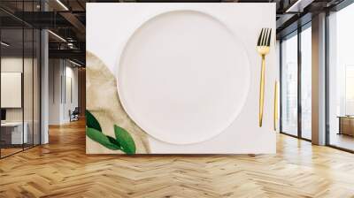 empty plate and golden cutlery on the white table. minimalist table setting Wall mural