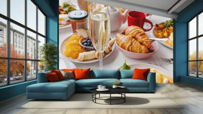 Glass of champagne close-up on the table with different breakfast and brunch dishes Wall mural