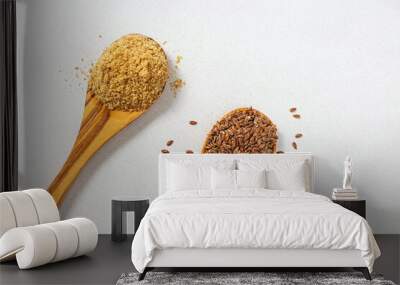 Two wooden spoons with flax seed and meal, healthy nutrition Wall mural