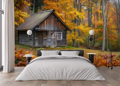 Cozy wooden old cabin surrounded by vibrant autumn foliage Wall mural