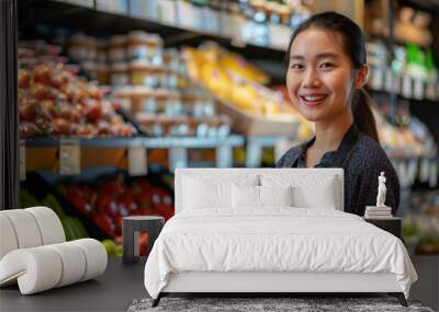 Smiling female asian seller in health food store Wall mural