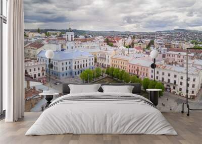 Aerial summer view of central part of beautiful ancient ukrainian city Chernivtsi with its streets with town hall, churches etc. Beautiful town. UNESCO world heritage site. Wall mural