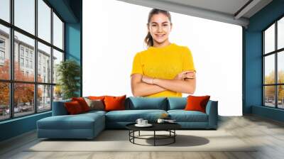 Beautiful teen girl student with confident expression, keeps arms folded. Portrait of smiling teenager isolated on white background. Wall mural