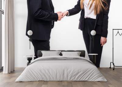 Businessman and businesswoman shaking hands isolated over white background Wall mural