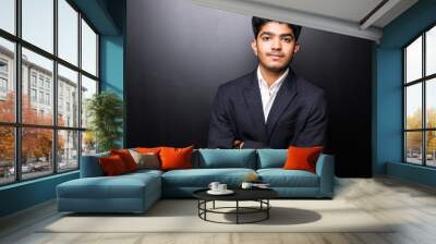 Portrait of an Indian business man isolated over black background. Wall mural