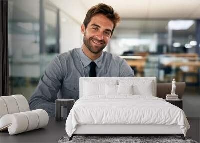 No one said success would be easy. Cropped shot of a handsome young businessman in his office. Wall mural