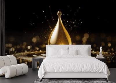 a golden drop on a black background shining with light Wall mural