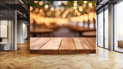 image of wooden table in front of abstract blurred background of resturant lights high quality photo Wall mural