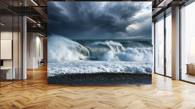 powerful ocean waves crash against the shore under a stormy sky creating a dramatic and intense seascape Wall mural