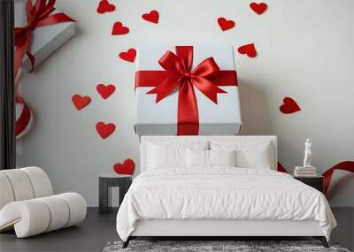 Gift boxes with red ribbon and festive decorations on white background for holidays and celebrations Wall mural