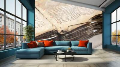 Open hardback old book, pages with text Wall mural