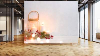 Christmas background, burning lantern candles decorated with frosted fir branches Wall mural