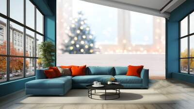 Table with space against blurred Christmas tree and decorated window Wall mural