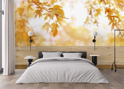 Wooden table in front of abstract blurred colorful autumn background Wall mural