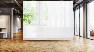 Wooden table top on blurred background of half curtained window Wall mural