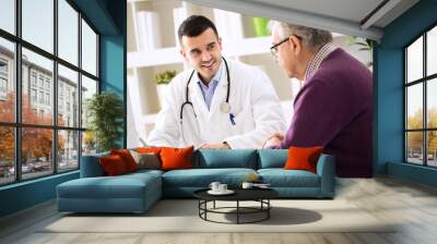 doctor explaining prescription to senior patient Wall mural