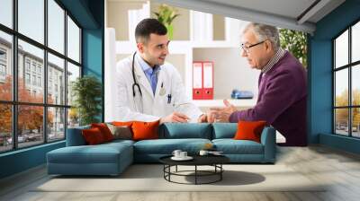 doctor listening to patient explaining his painful Wall mural