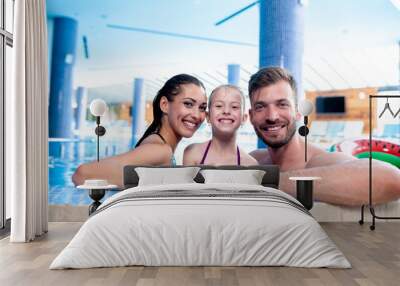 Happy family by the poolside Wall mural