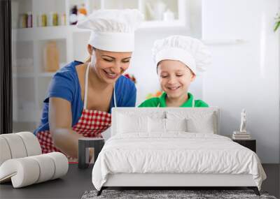 Happy smiling family preparing healthy food Wall mural