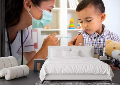 Little brave man receiving a vaccine Wall mural