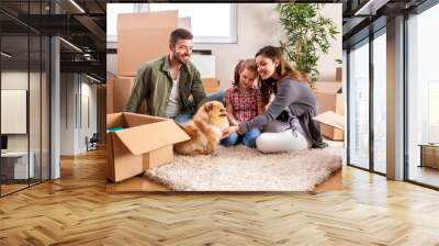 Mom, dad, their daughter and their dog moving in Wall mural