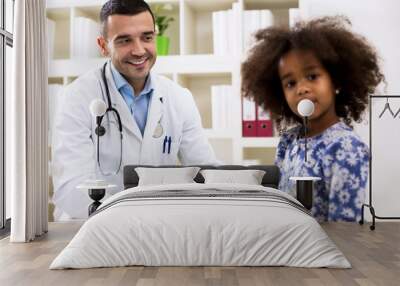 Pediatrician looking to his little girl patient Wall mural