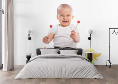 smiling baby child playing metallophone Wall mural