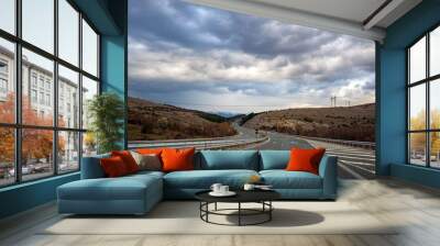 driving on the highway with cloudy sky Wall mural