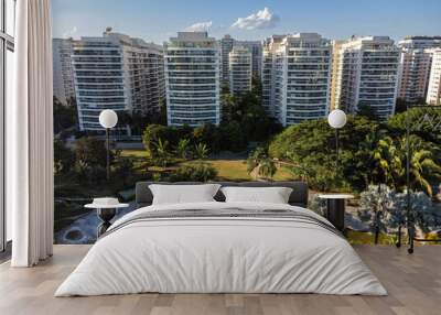 Aerial view of Rio 2 park in Rio de Janeiro, Brazil. Residential buildings and mountains around. Sunny day. Sunset. Drone photo Wall mural