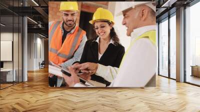 Architect Engineer And Manual Worker Meeting In Construction Site Wall mural