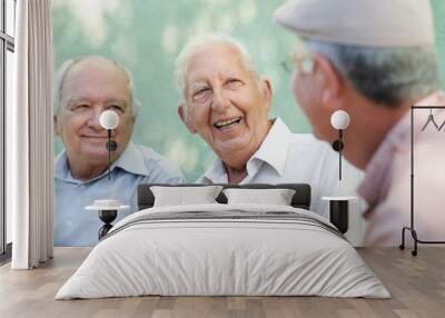 group of happy elderly men laughing and talking Wall mural