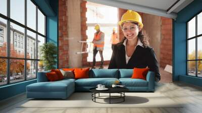 Happy Young Woman Working As Architect In Construction Site Wall mural