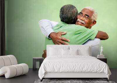 old friends, two senior african american men meeting and hugging Wall mural