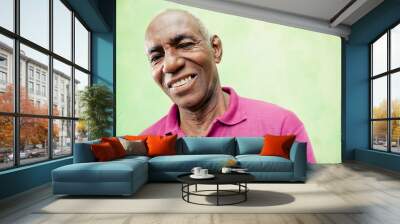 portrait of elderly black man looking and smiling at camera Wall mural