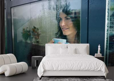 woman staring at the window Wall mural